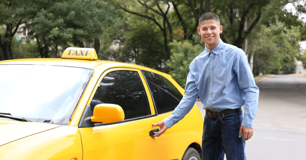 A Cancun taxi driver near his taxi