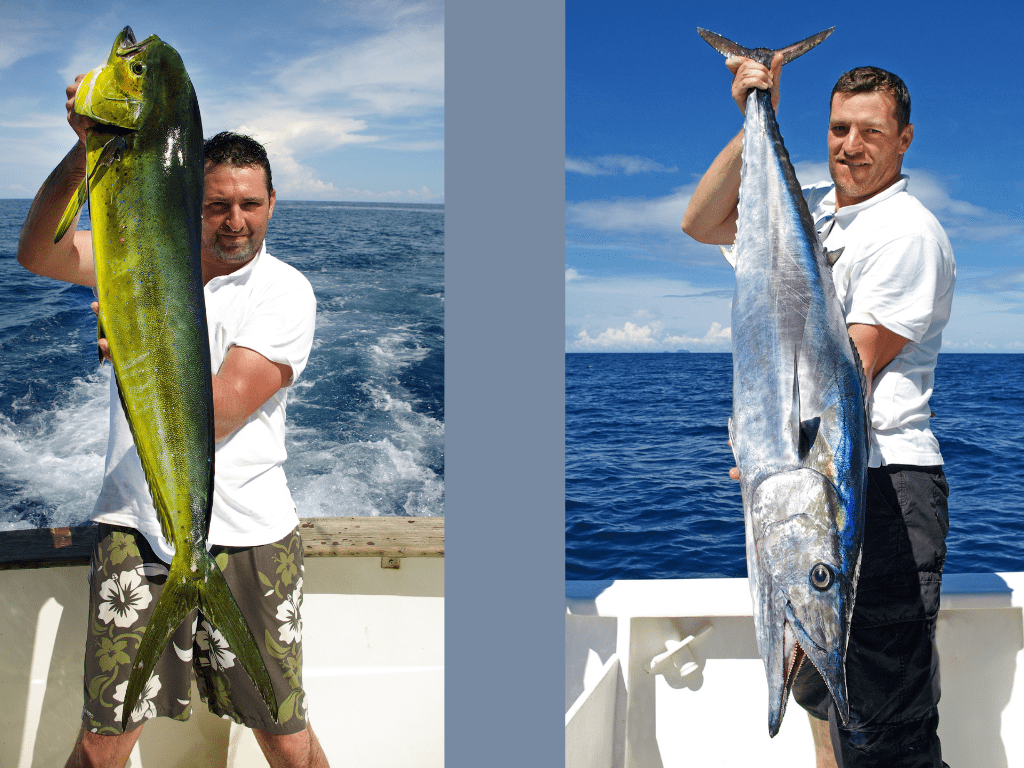 2 men holidng different fish caught while deep sea fishing