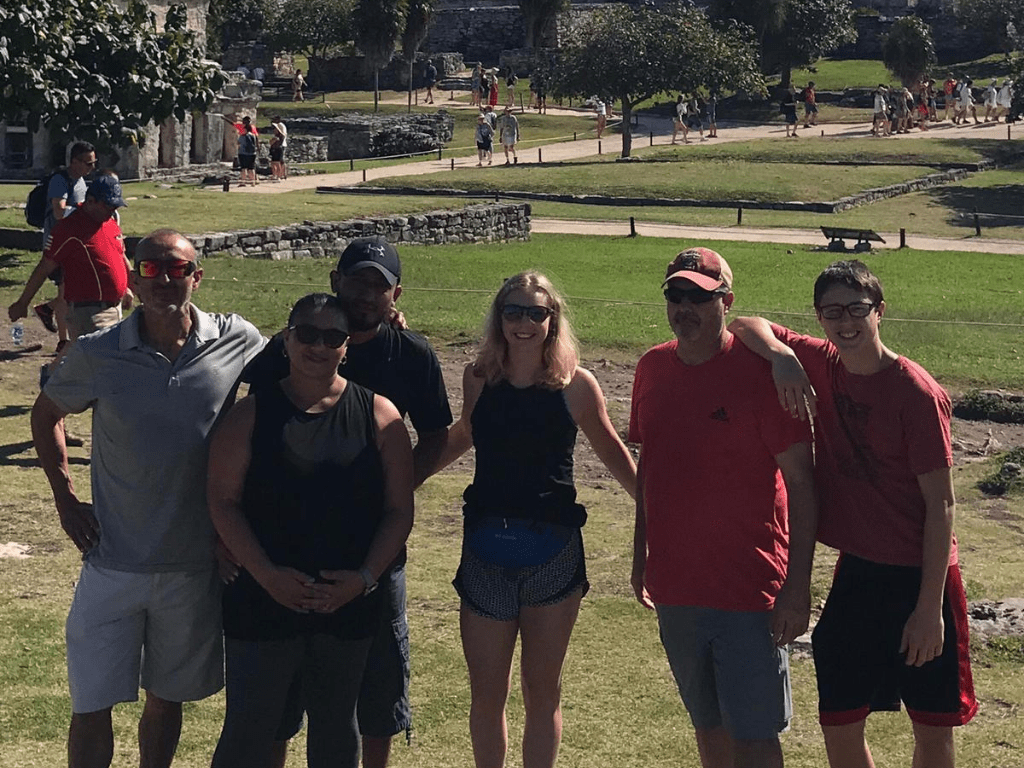 Family visiting Tulum ruins