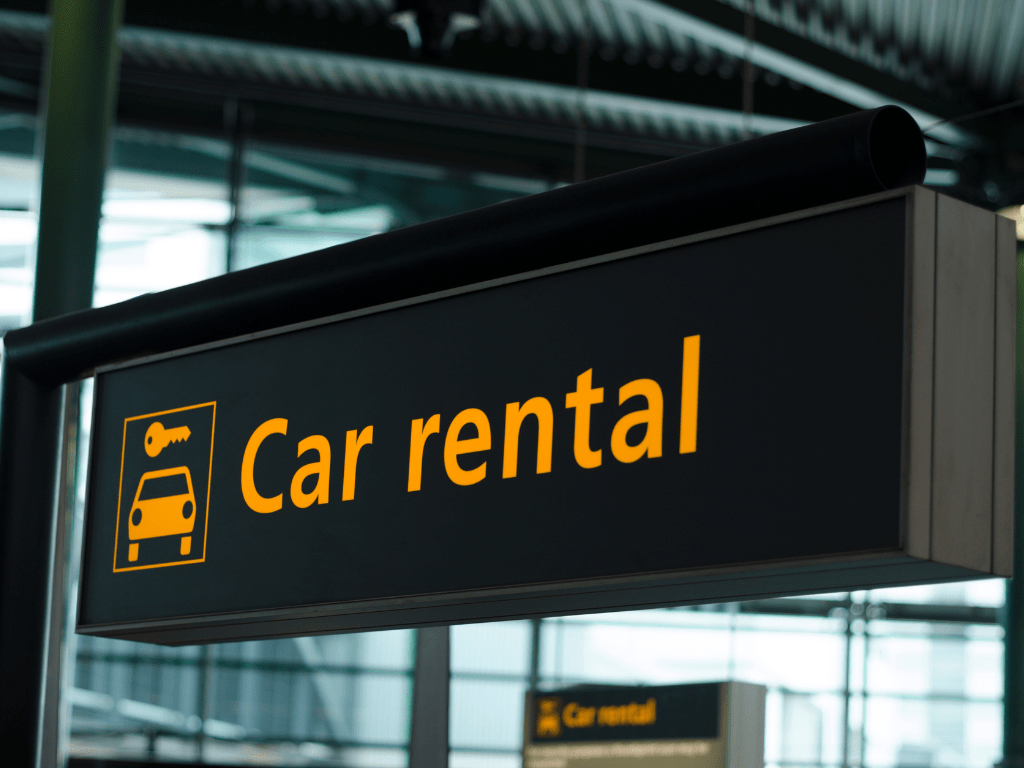 car rental sign at an airport