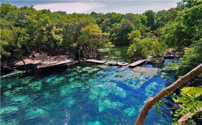 Aerial image of cenote azul in Tulum Mexico