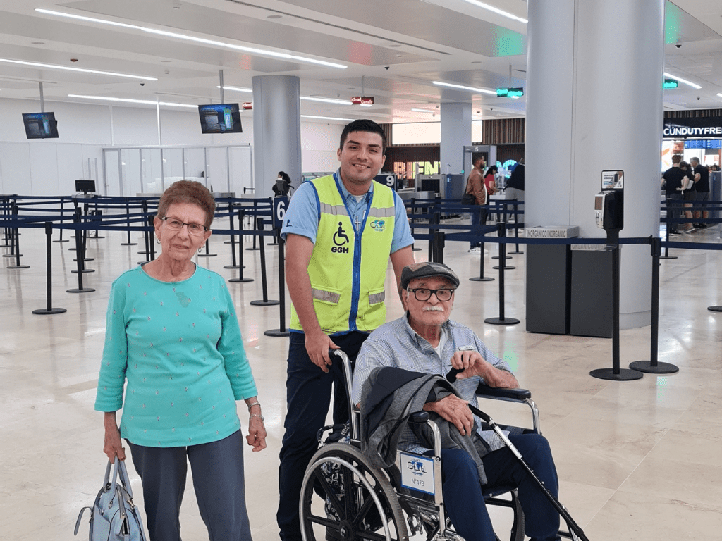 older couple being assisted at Cancun international airport